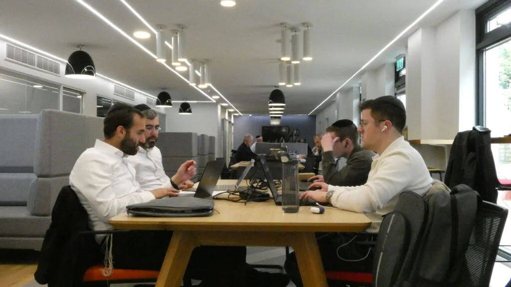 The Work Avenue shared workspace with people working at desks.